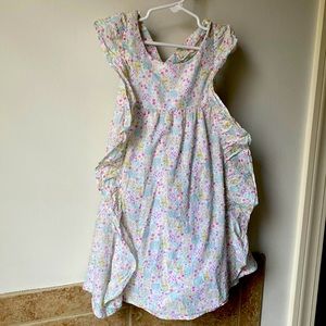 Size 5 100% cotton dress with frills on the front and button detail on the back